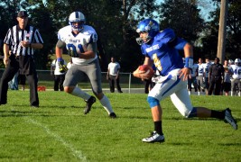 Justin Summers racing away from Mayville State defenders.