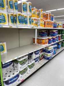 mostly empty grocery store shelves