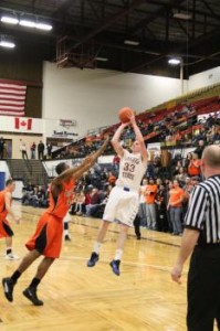 Senior forward Luke Lamb shoots over a Jamestown defender. Lamb recorded a double-double in the exciting win, with 15 points and 10 rebounds. (Photo provided by DSU Athletics)