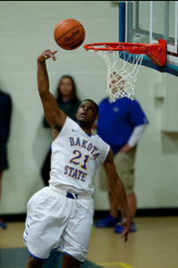 Yusuf Vinson scoring a basket for the Trojans