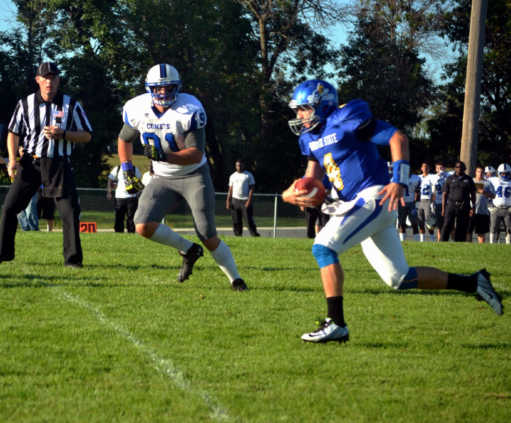 Justin Summers racing away from Mayville State defenders.