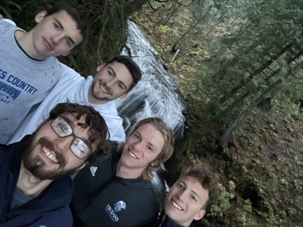 group selfie in front of waterfall