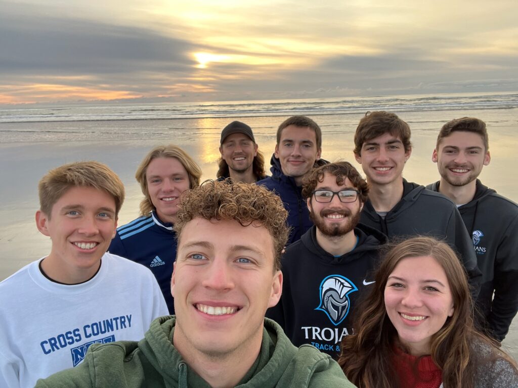 group selfie in front of beach