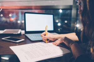 woman writing in notebook