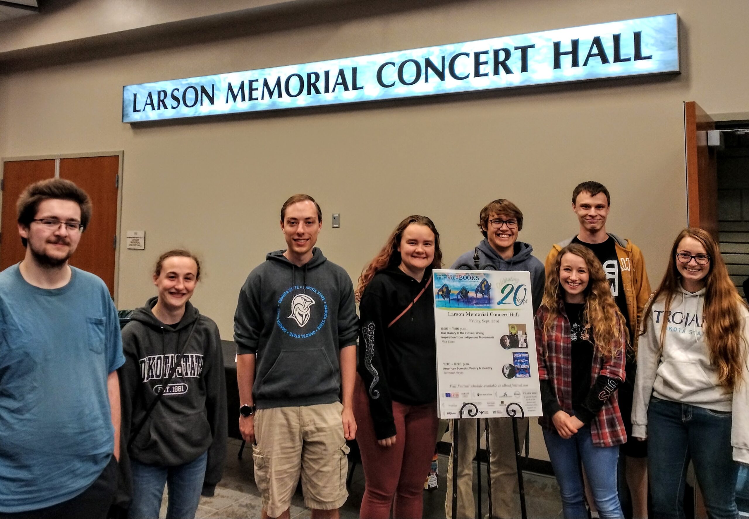 6 students standing and smiling