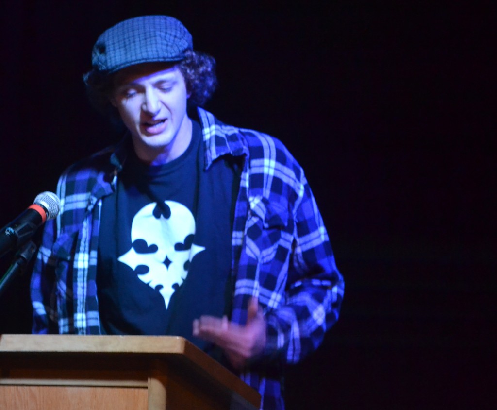 Andrew Koerner lays the poetry hammer down on some unwary faculty at the recent Slam competition.